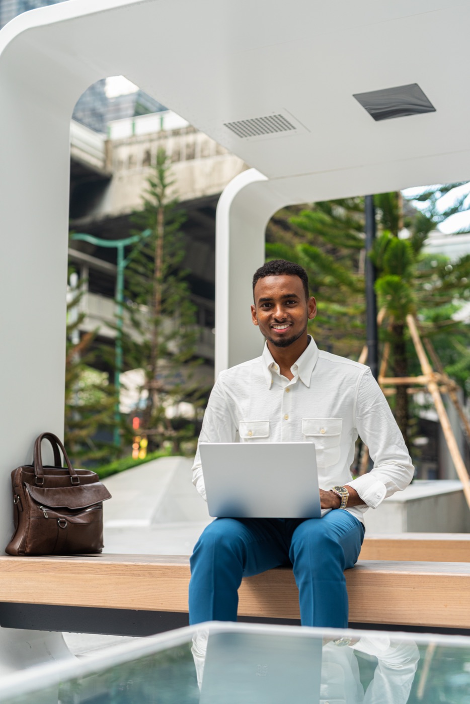 A participant working on a laptop outdoors