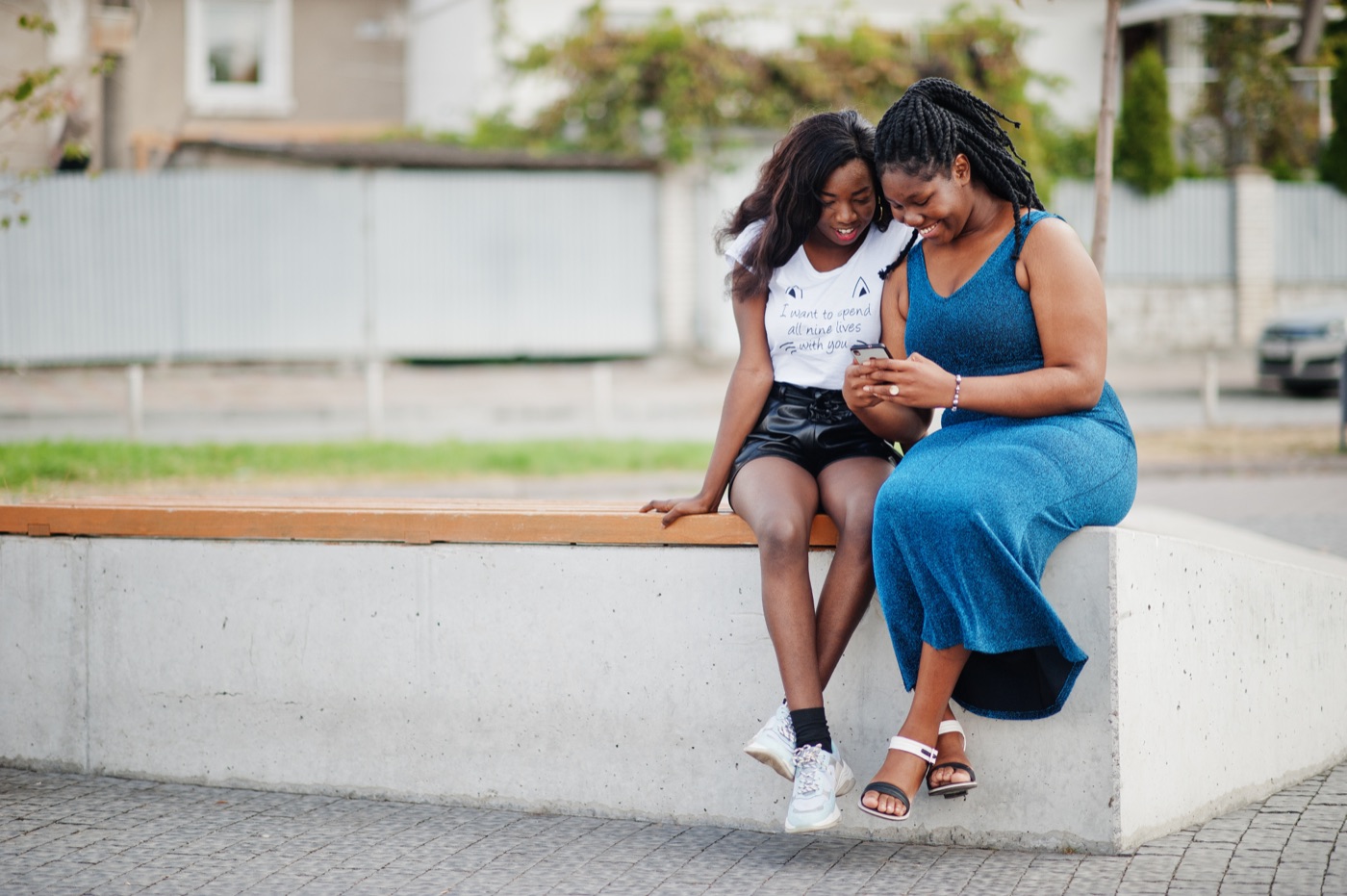 A mother and daughter looking at a phone together